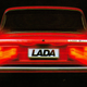 An image of the rear of a Lada car with blurred tail lights.